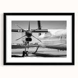 Extra large, colorful abstract art print of an airplane, textured on black framed canvas, ideal for living room decor.
