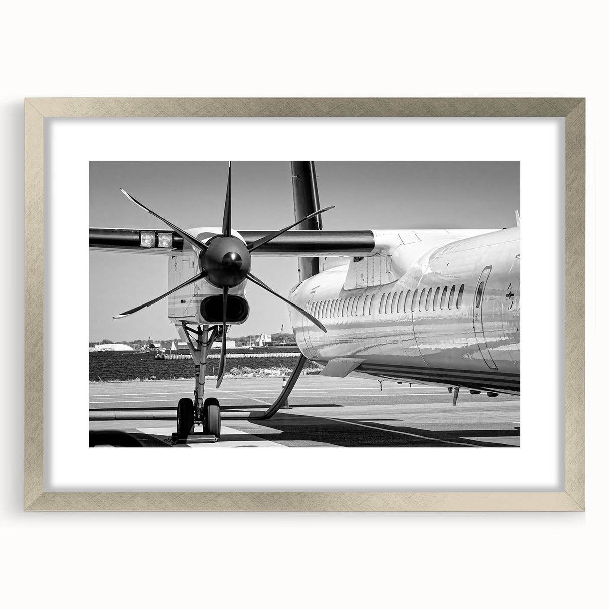Textured art print of abstract airplanes in muted gray and silver tones on a framed canvas, suitable for bedroom decor.