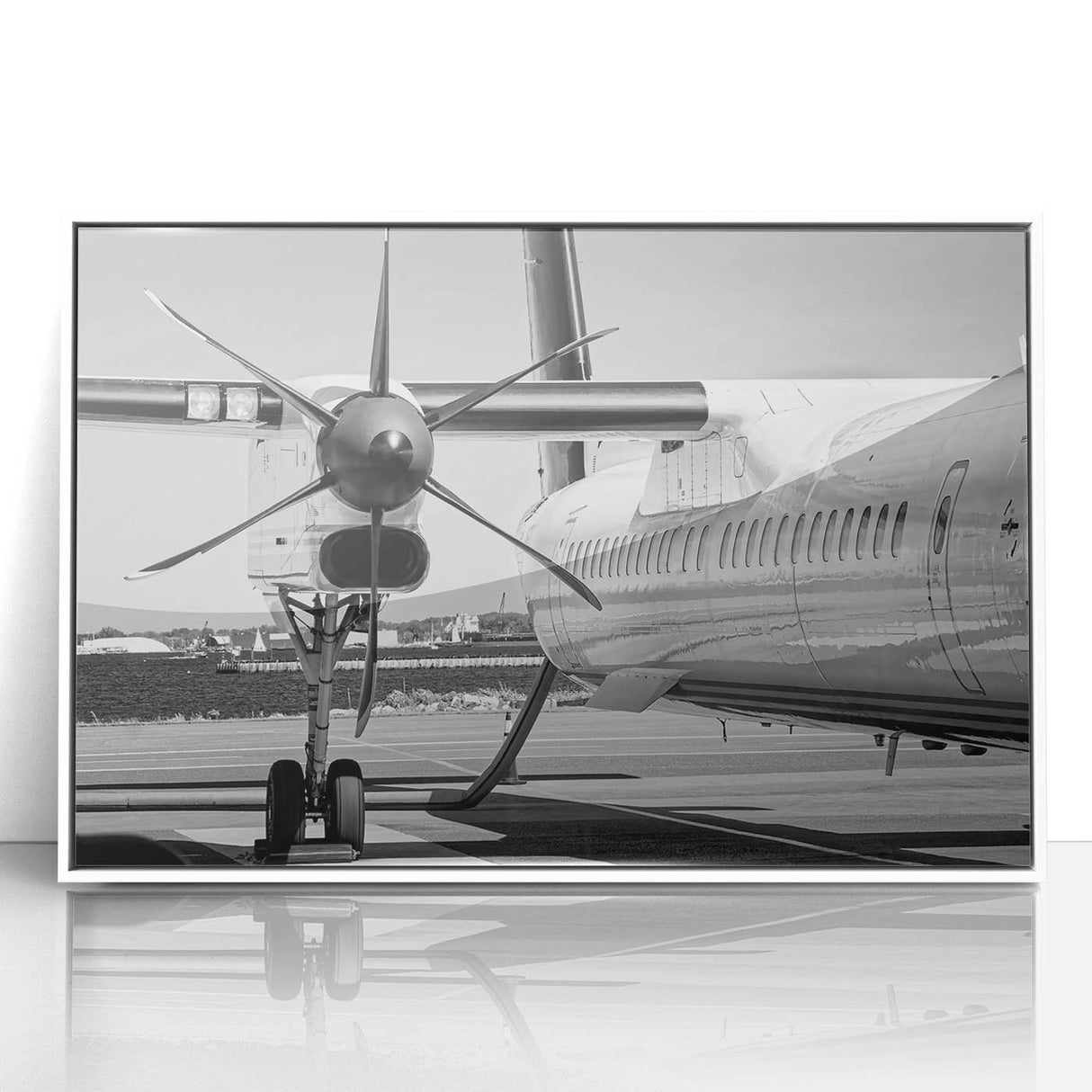 Framed acrylic print featuring mid-century modernist style airplanes in muted blue and gray, ideal for nursery wall art.