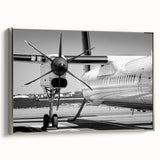 Framed canvas featuring a vintage airplane in grayscale against a colorful abstract landscape, ideal for office decor.