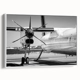 Vintage poster art of a classic airplane on a white framed canvas, featuring a monochrome palette.
