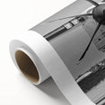 Art deco poster of a vintage airplane, in muted silver and blue tones, on rolled canvas, ideal for nursery wall art.