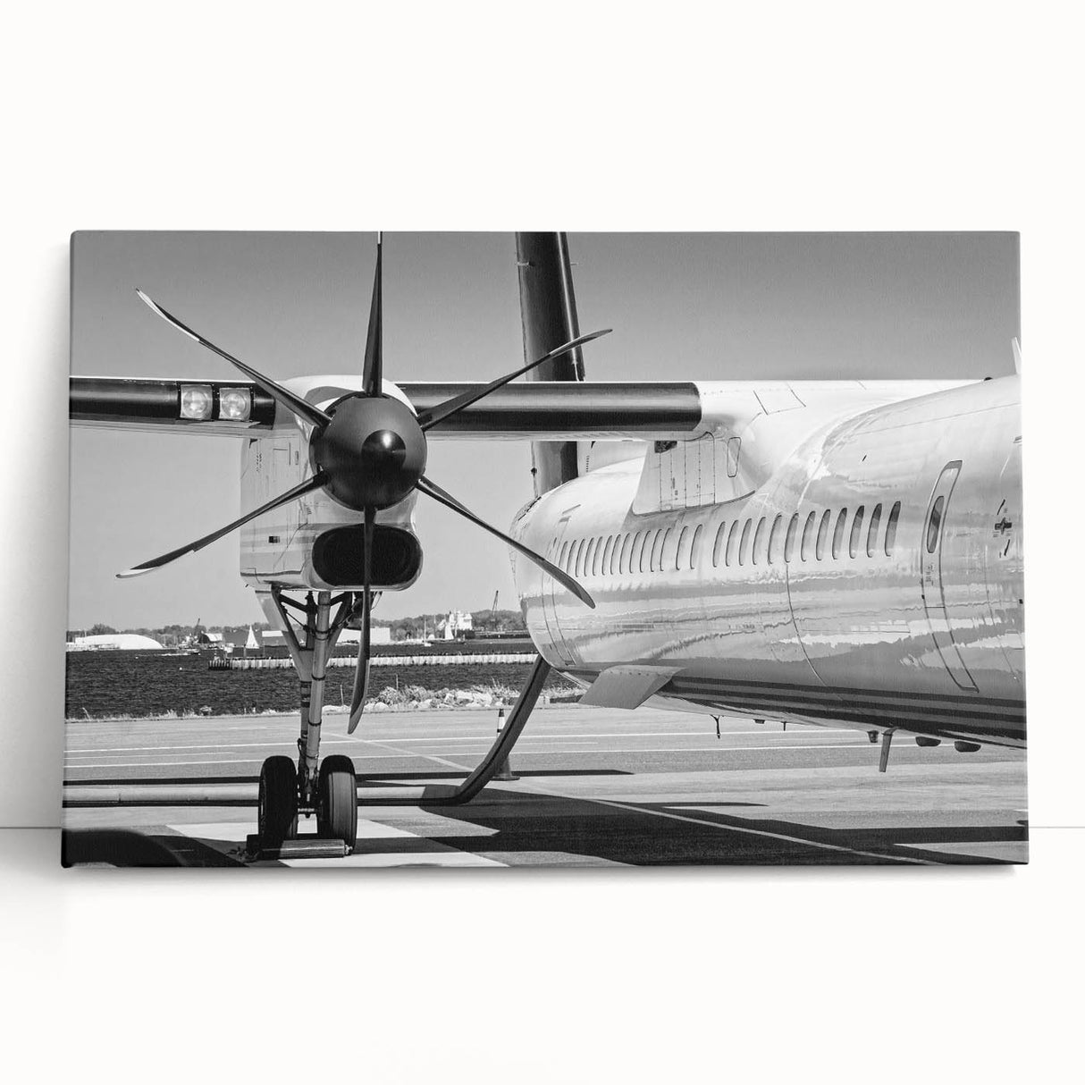 Black and white photo of a vintage airplane on stretched canvas, suitable as large kitchen wall art or bedroom decor.