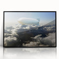 Large abstract wall art featuring a mid-century modernist airship design in black and white tones on a framed acrylic panel.