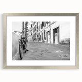 Textured art print of an abstract bicycle in silver and gray tones on a framed canvas, suitable for bedroom decor.