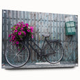 Side view of a large abstract bicycle print on acrylic glass, featuring neutral and blue shades.