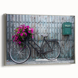 Framed canvas of a vintage bicycle in black with colorful accents, ideal for decorating a home office.