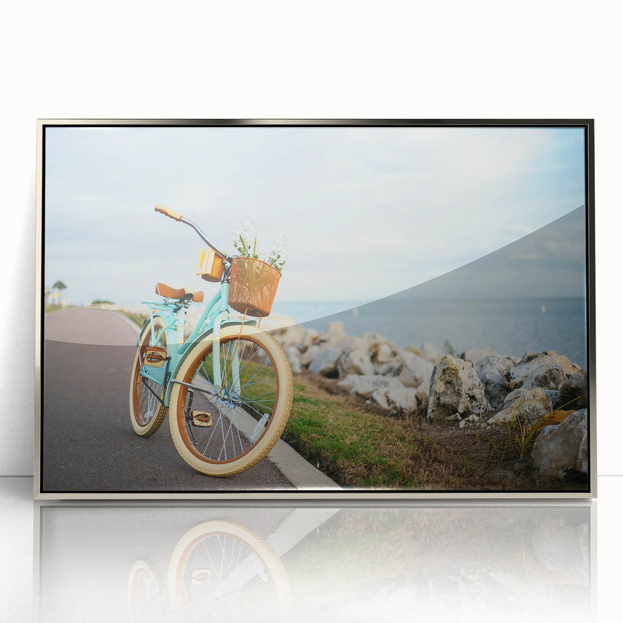 Mid-century modernist art depicting a bicycle, in muted gray, on a silver-framed acrylic, suitable for nursery wall art.