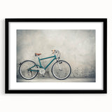 Abstract art print of a colorful bicycle on a textured canvas, framed in black, ideal for living room decor.