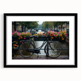 Abstract art print featuring a colorful, textured depiction of bicycles on a large black-framed canvas.