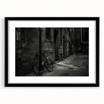 Extra large abstract art print of a colorful bicycle on textured canvas, framed in black, ideal for living room decor.