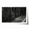 Vintage-style bicycle print in muted earth tones on rolled canvas, ideal for art wall dining room.