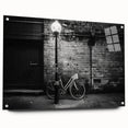 Side view of a bicycle depicted in large abstract style on acrylic glass, using neutral tones.