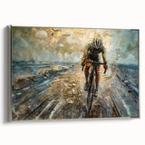 Vintage poster art of a black bicycle against a colorful abstract landscape, printed on a silver-framed canvas.