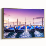 Framed canvas depicting a Venetian gondola on a canal in muted black and gold tones.