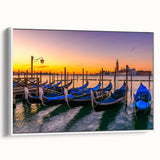 Framed canvas featuring a vintage poster art style landscape of a gondola on water, in muted black and gray tones.