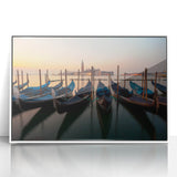 Acrylic print of a gondola on calm waters, in muted earth tones, framed in white, ideal for modern art wall decor.