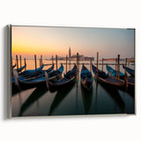 Vintage poster art of a gondola on a canal, featuring a black frame and vibrant colors.