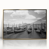 Mid-century modernist art depicting a gondola on water, in muted gold and blue tones, framed acrylic.