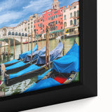Framed canvas featuring a textured black gondola on colorful, abstract water, ideal for extra large living room wall art.