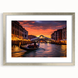 Abstract art print of a gondola on water in muted blue and gray tones, framed in silver, suitable for dining room decor.