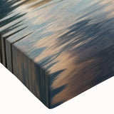 Black and white photograph of a rowboat on calm water, printed on stretched canvas, suitable for bedroom wall art.