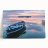 Black and white photo of a rowboat on water, printed on large stretched canvas.