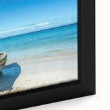 Close-up of a black wall art featuring a textured rowboat design with colorful accents on a framed canvas.