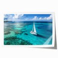 Art wall featuring a sailboat on tranquil waters in muted blue and white tones, printed on rolled canvas.