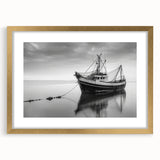 Textured art print of an abstract sailboat in muted blue and gold tones on a gold-framed canvas.