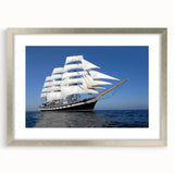 Textured abstract art print of a stylized boat, using blue and gray tones on a silver-framed mat, suitable for bedroom art.