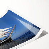 Extra large wall art of a ship at sea, depicted in muted blue tones on rolled canvas, suitable for large living room decor.