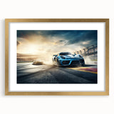 Extra large abstract art print of race cars in motion, using textured, vibrant red and blue tones on a gold-framed canvas.