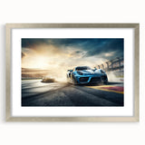 Textured art print of abstract race cars in motion, using a palette of gray and silver, framed with a silver mat.
