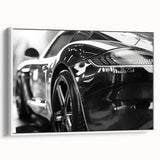 Vintage poster art of a classic car in vibrant colors on a large framed canvas, ideal for living room decor.