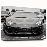 Side view of a red sports car on acrylic glass, with a sharp focus and clear details.