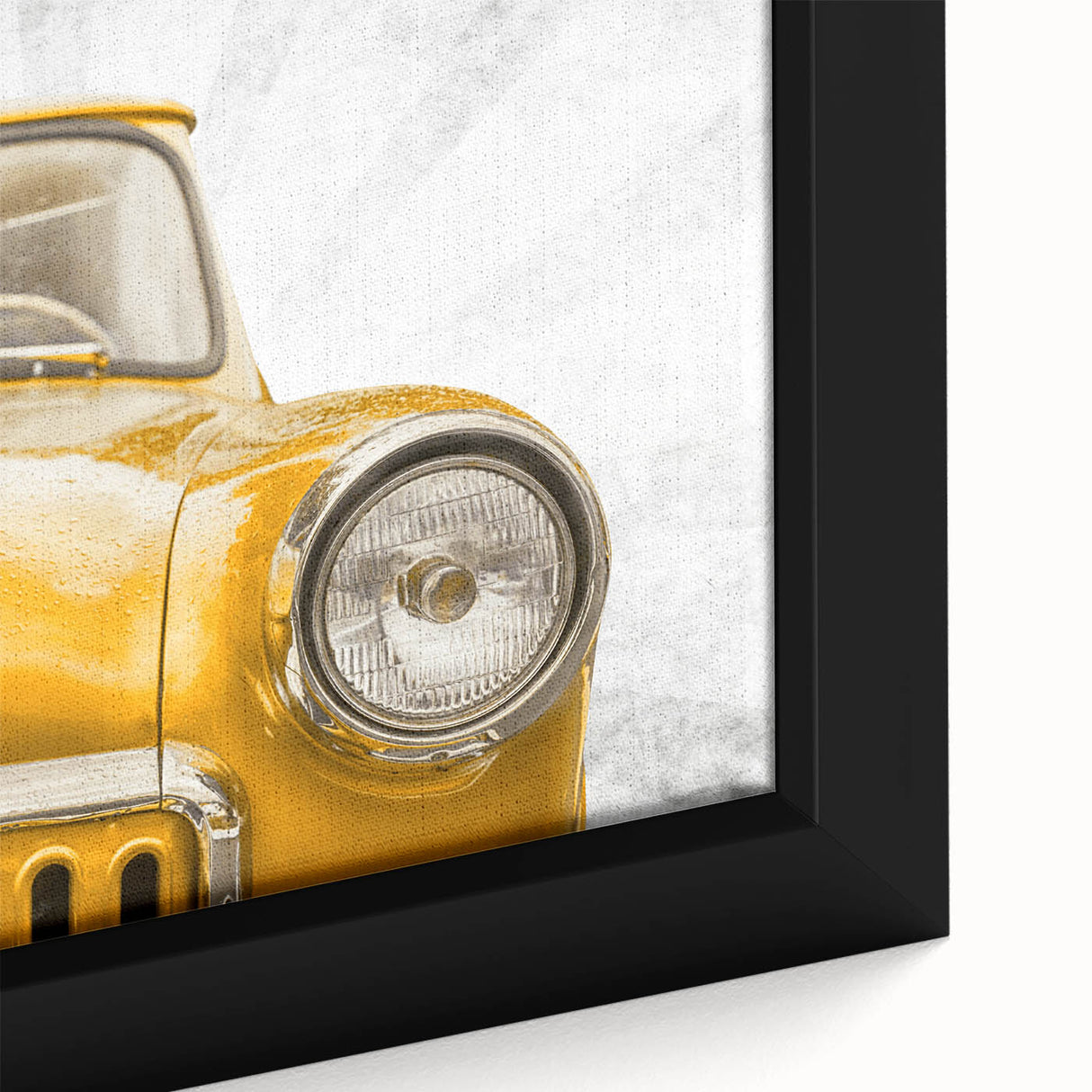 Close-up of a textured, black wall art featuring vintage cars in colorful art style on a framed canvas.
