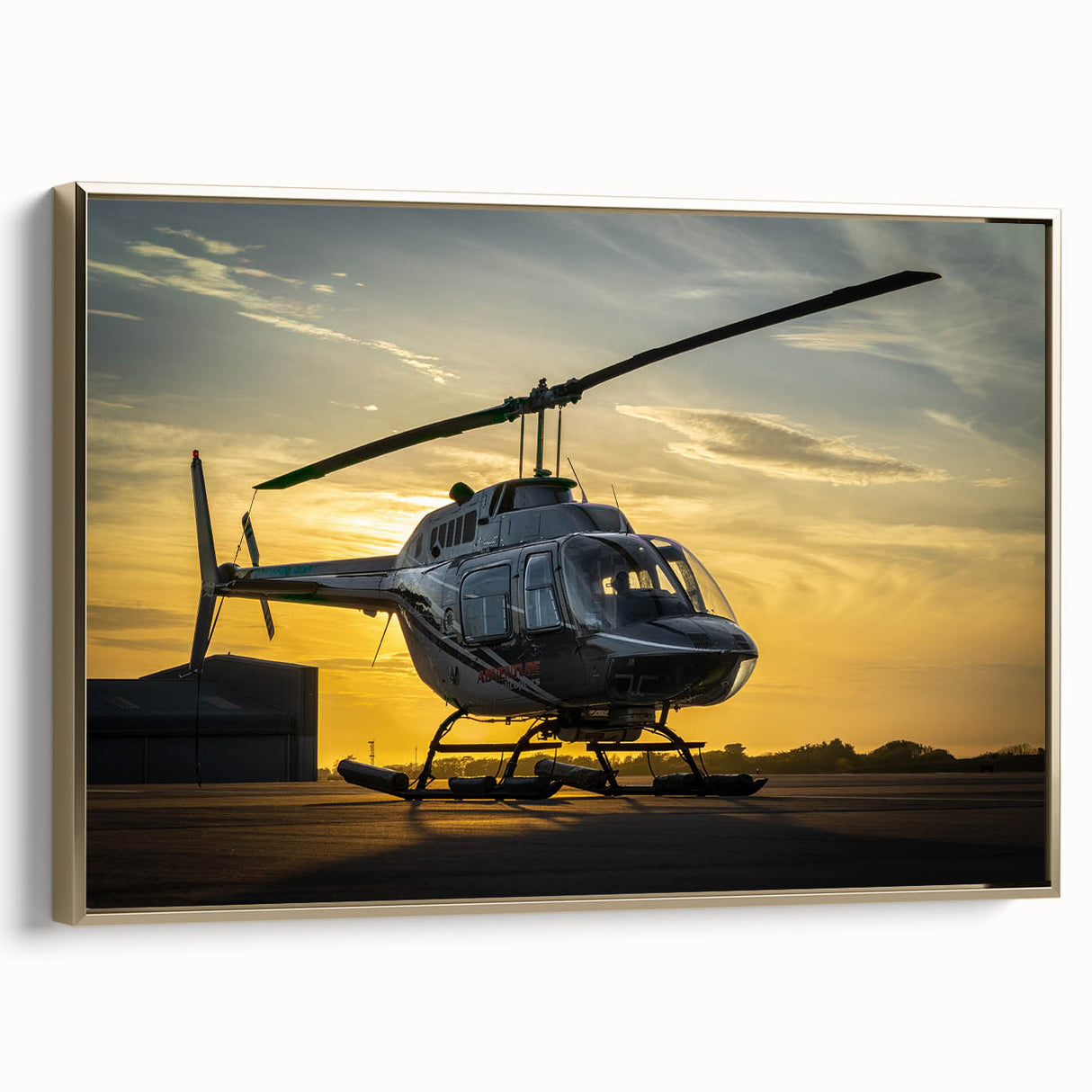 Side view of a vintage helicopter in gold on a black framed canvas, ideal for bedroom wall decor.