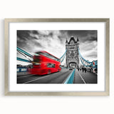 Textured abstract art print of service vehicles in muted gray and blue tones, framed in silver.
