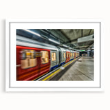 Abstract art print of a stylized subway in muted grays and blues, framed with a white mat.