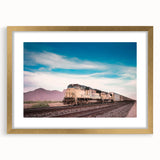 Extra large abstract art print of a stylized train, in muted gray and gold tones on a framed canvas.