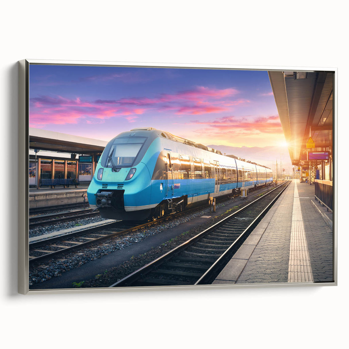 Framed canvas featuring a vintage train in motion with a colorful landscape background.