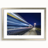 Textured abstract art print featuring a stylized train in muted grays and blues, framed in silver, ideal for bedroom decor.