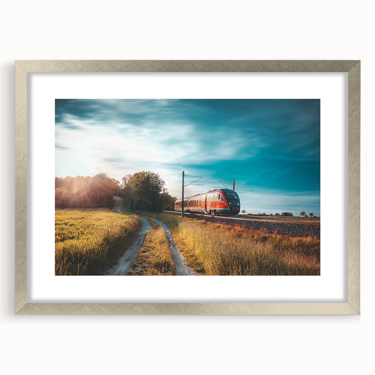 Textured abstract art print of a stylized train in muted gray and silver, framed with a silver mat.
