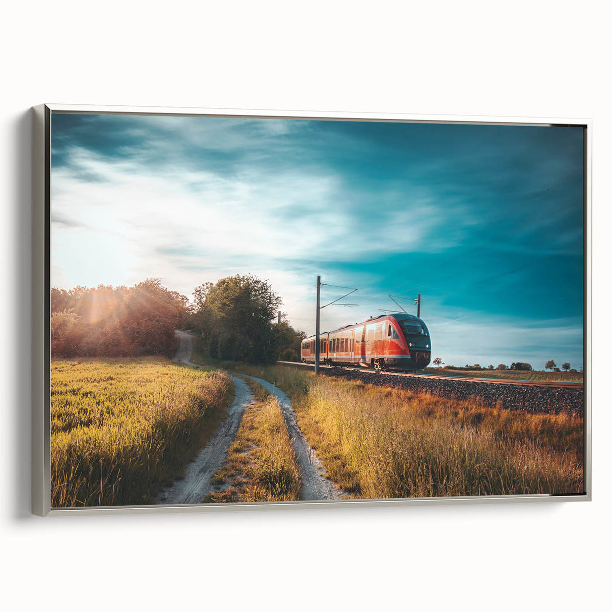 Framed canvas featuring a vintage train in black with colorful landscape background, ideal for office decor.