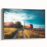 Framed canvas featuring a vintage train in black with colorful landscape background, ideal for office decor.