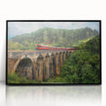 Large abstract wall art depicting a train in muted gray and blue tones, framed in black acrylic.