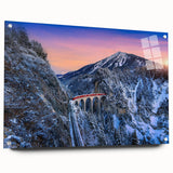 Side view of a large abstract train depicted in vibrant blue and orange tones on acrylic glass, ideal for dining room decor.