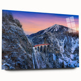 Side view of a large abstract train print in vibrant blues and oranges on acrylic glass.