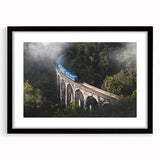 Abstract art print of a colorful, textured train on black-framed canvas, ideal for extra large wall art in a living room.
